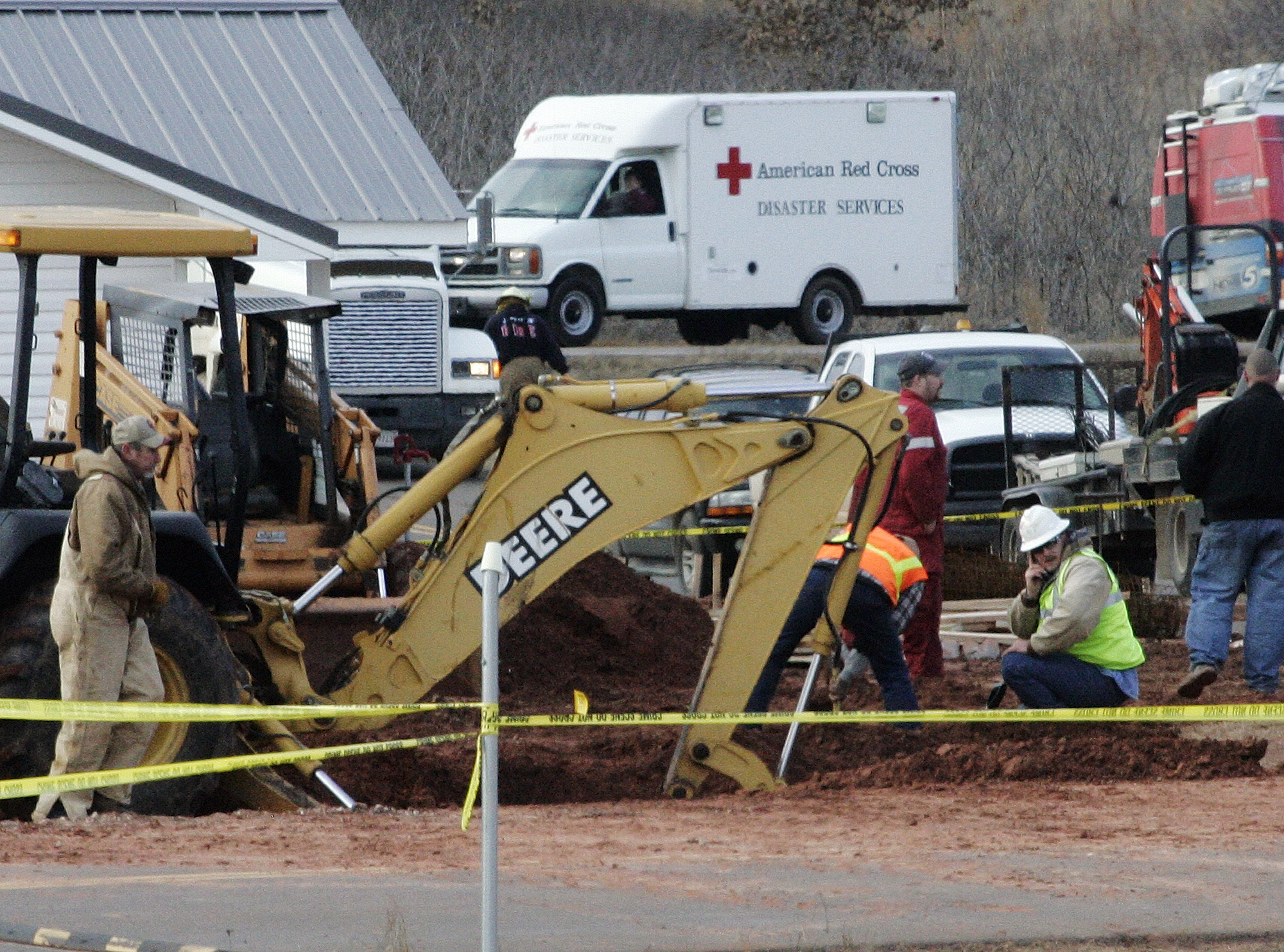 Workers attempt to recover the bodies of two construction workers who became trapped when a trench collapsed near the Kickapoo Casino in McLoud, Okla., Tuesday, Feb. 16, 2010.  (AP Photo)
