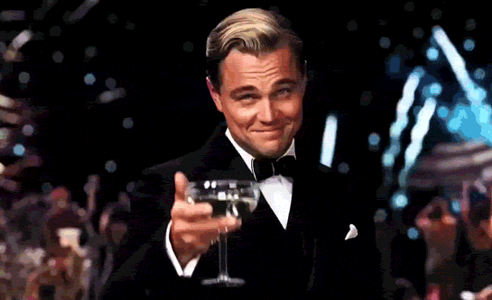 Leonardo Dicaprio as Jay Gatsby raising his glass